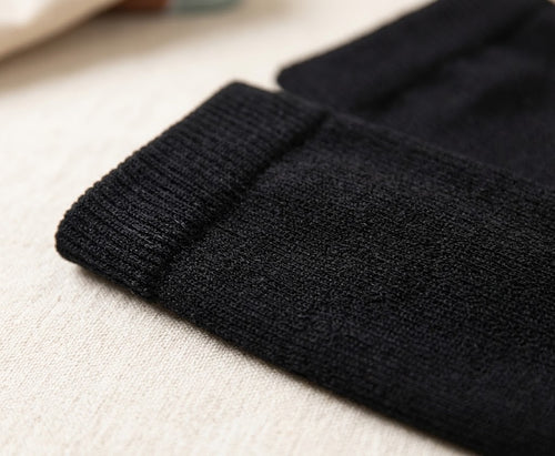 BackOnPace black compression socks — woman working on laptop during post-run recovery